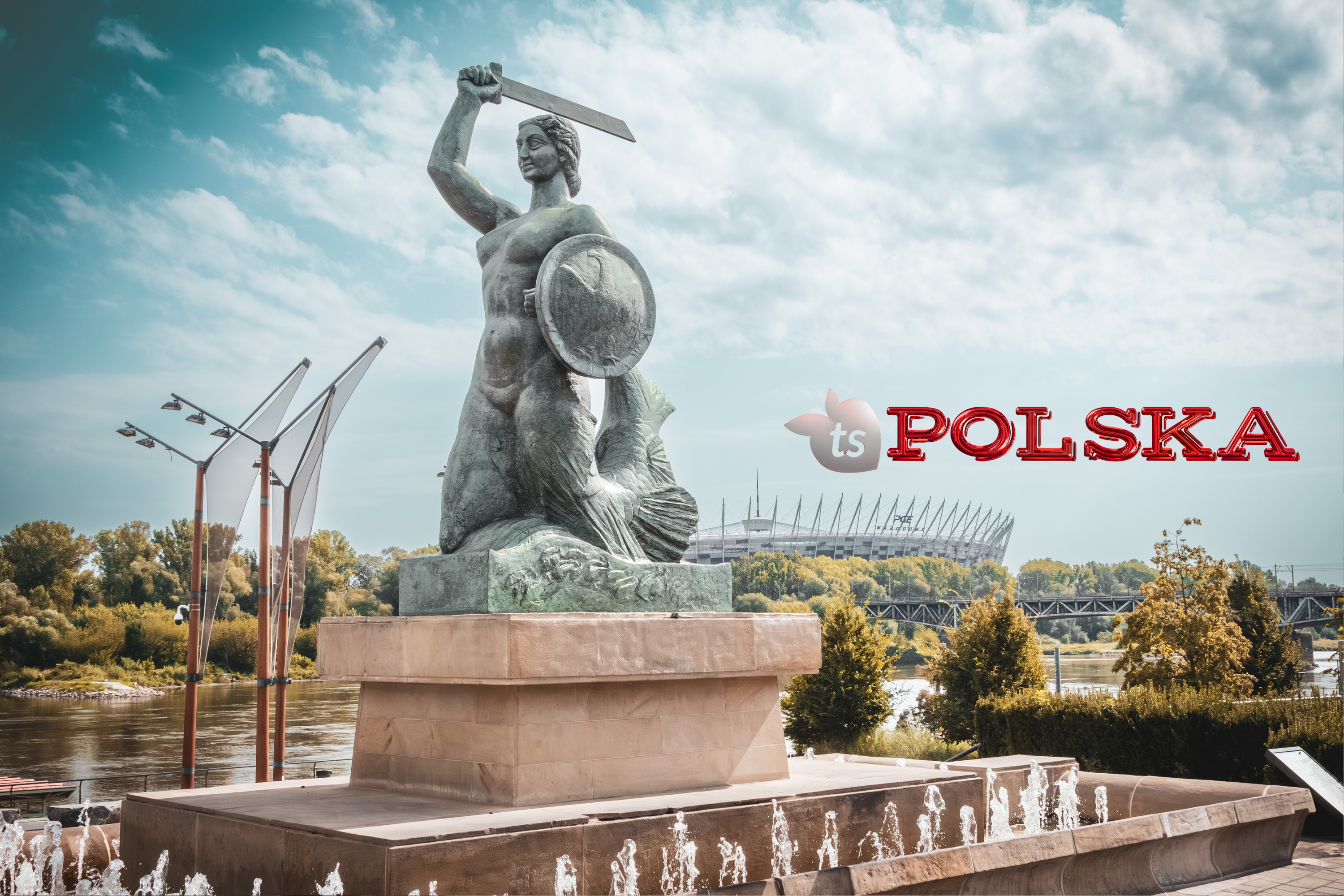 Statue with shield and sword against a blue sky with clouds, featuring 'ts POLSKA' logo.